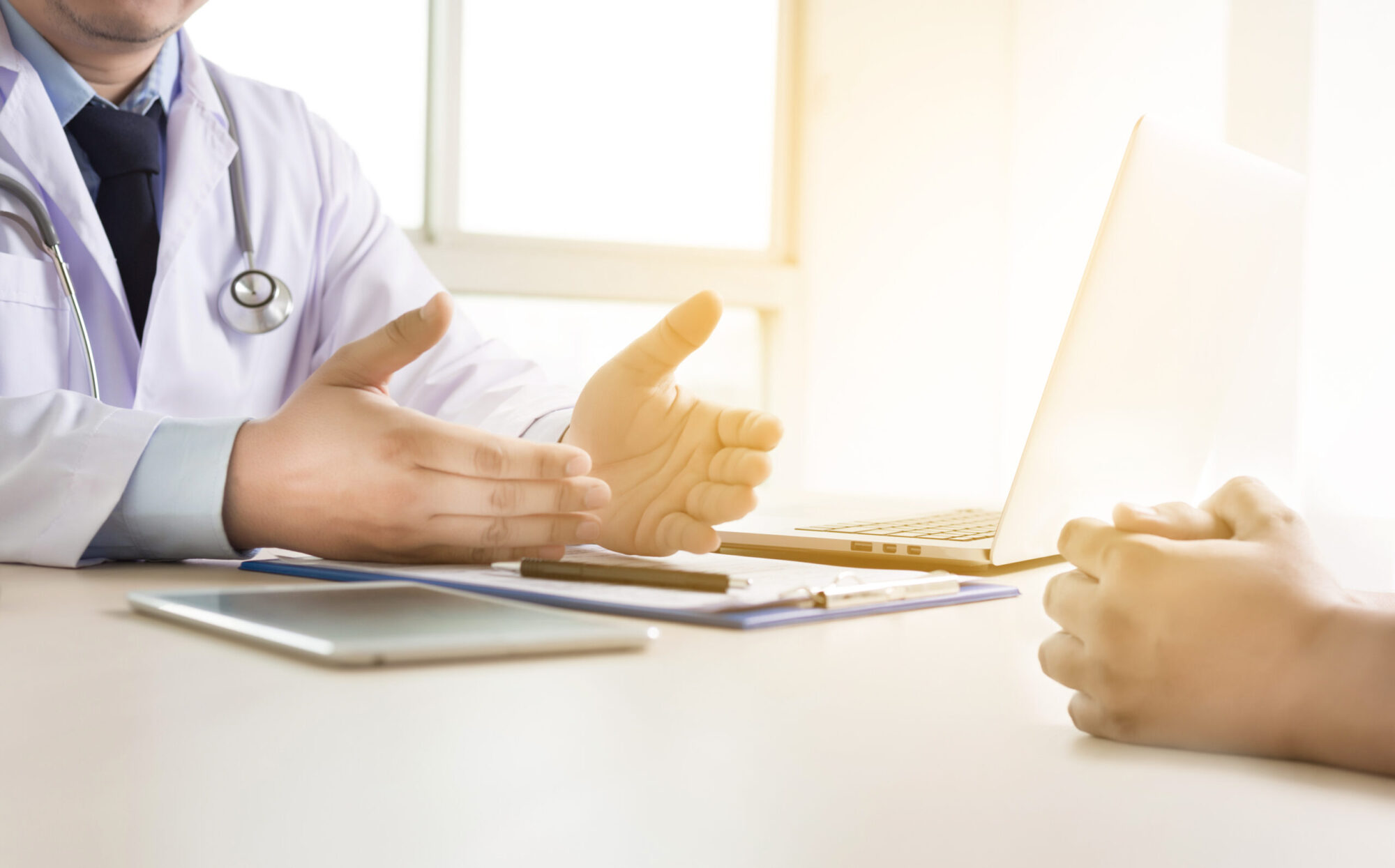 doctor  taking patient are discussing something in hospital on c