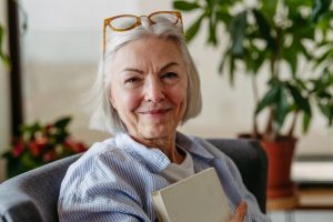 woman over 60 arranging flowers