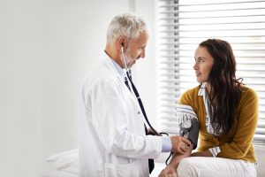 patient at doctor receiving blood pressure test